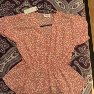 pink and white floral blouse